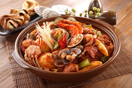 Big bowl of Spicy Seafood galbijjim with clams, shrimp, octopus,