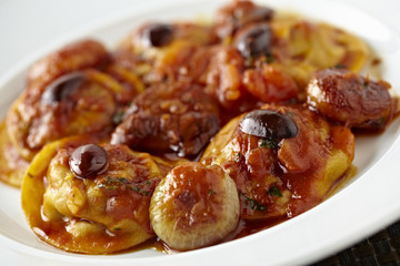 Sauteed Molyvos OctopusStifado in Japanese style on white plattt