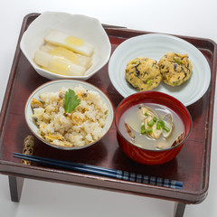 Table meal of fried rice with meat ball, clam soup and egg in Ja
