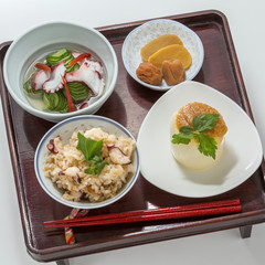 Table meal of Takikon rice in soy sauce and Sakura rice with sli