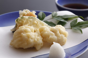 Fried breaded vegetables tempura on white dish