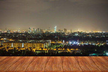 Empty wooden table over cityscape for your product display monta - obrazy, fototapety, plakaty
