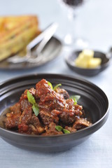 Stewed minced beef in asian style in black bowl