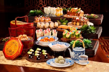 Obraz na płótnie Canvas Plenty of cake and tea for mid autumn festival in asia
