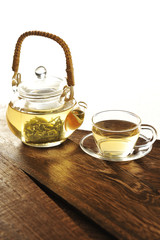 Set of green tea cup on wooden table in white background