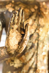 Hand of Buddha statue in old Thailand temple