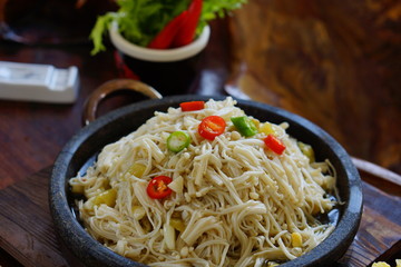 Fried mushroom with hot chili on stew in restaurant
