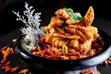 Special spicy fried crab in Chinese style on black plate