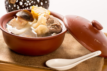 Crunchy Coconut Shrimps and pork soup in stew