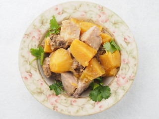 Braised sweet potato on plate in asian restaurant