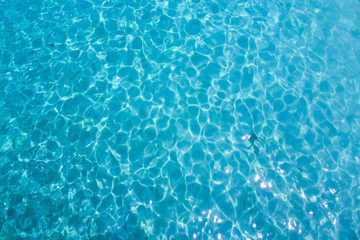 blue ripped water in the sea with sunny reflections background, Thailand