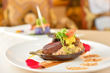 Deep fried beef with rice and salad on white plate plate in asia