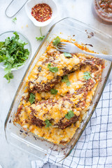 Baked mexican salsa chicken in glass bowl on the table