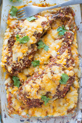 Baked mexican salsa chicken in glass bowl on the table