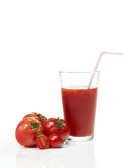 Tomato juice in glass on white background