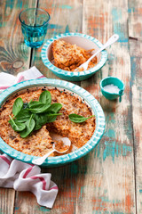 Casserole with cabbage, meat, tomato and cheese, selective focus