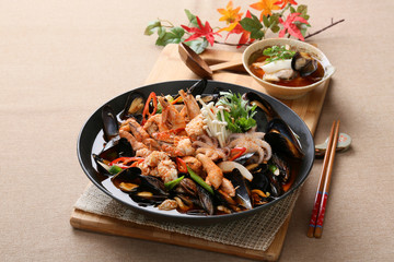 Cool and spicy seafood soup taste with octopus, clams, mussels a