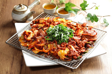 Grilled duck in Korean jumulreok style with herbs on the table