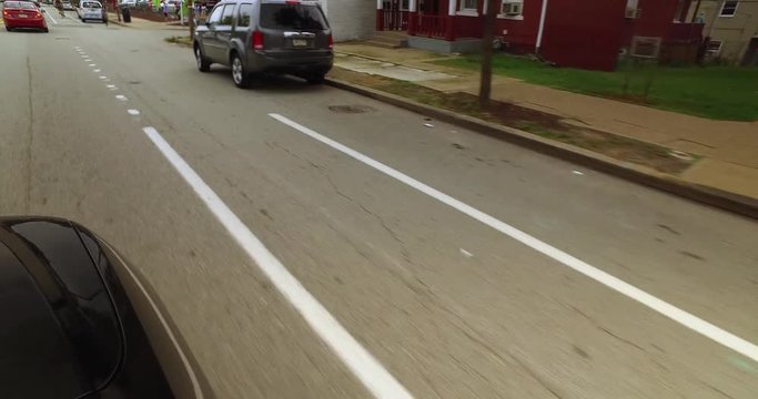 A detailed view of a dedicated bicycle lane on the street of Pittsburgh's Bloomfield area.  	