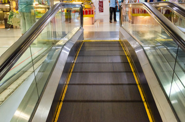 modern escalator in shopping center in the mall.