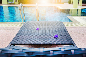 Poolside loungers at an exotic asian hotel. And the evening sun.