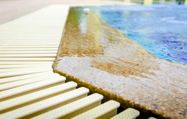 swimming pool and gutter water overflow and sandwash terrace. at the hotel.