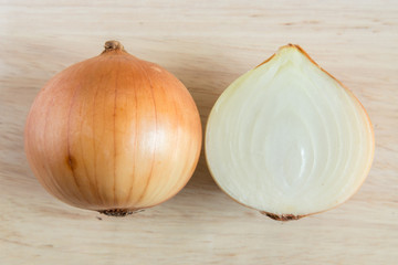 Onions on wooden cutting board