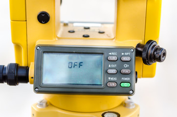 Closeup theodolite outdoors at construction road  Selective focus.