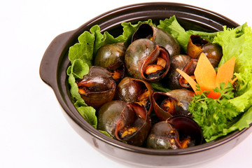 Fried Vietnamese snails with pepper and salads in mekong style b