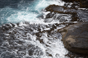 Waves crashing on Rocks