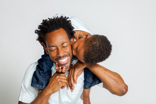 African American Boy Kisses Father