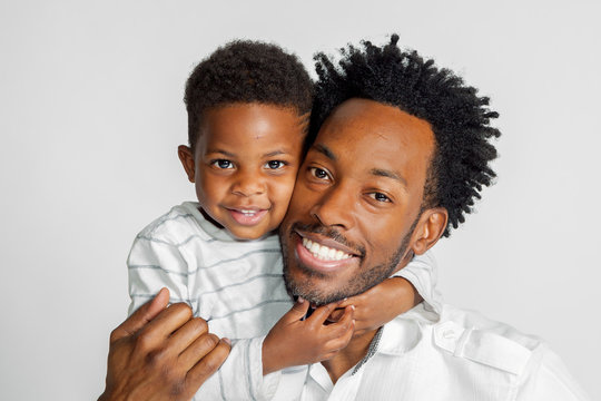 African American Father and Son Hug For A Portrait