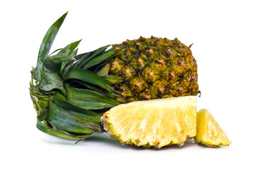 Fresh pineapple with slices isolated on white