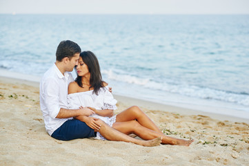 Beautiful romantic couple on the sea shore