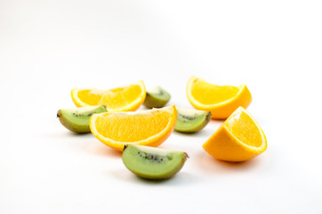Fototapeta na wymiar Sliced orange and kiwi on white background.