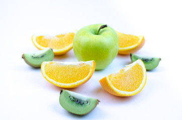 Fototapeta na wymiar Apple and sliced orange and kiwi on white background.