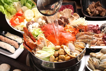Supper crab hot pot with mushroom, clams, shrimps, corn and vege