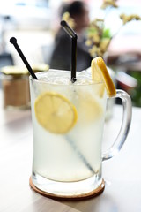 Glass of cold lemon juice with ice in a coffee shop in asia