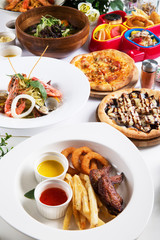 Special meal with fried octopus, shrimp, pizza, seafood soup buf