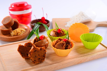 Bolu steamed brown sugar muffin with berries on wooden tray