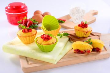 Strawberry cake muffin with eggs and mint leaf on wooden tray