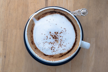 Latte coffee and mini garden in cup