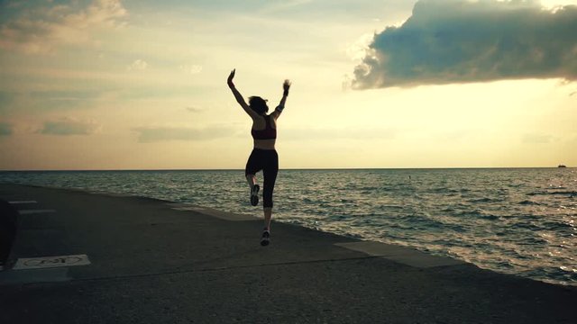 Runner athlete doing exersises at seaside