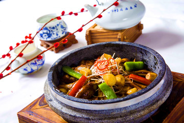 Freshwater eels braised with chili, vegetables and herbs in chin
