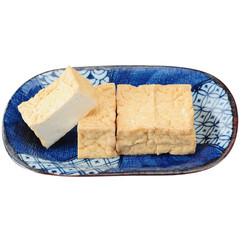 Fried tofu on chinese plate on white background