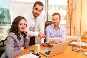 Group of business associates working together at the office