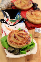 Chicken and mushroom pie on wooden table in restaurant