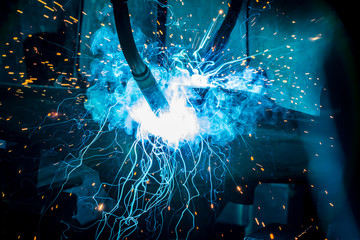 robots welding in a car factory