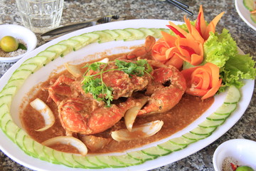 Roasted crab with salt soup and onion, lettuce, carrot on white