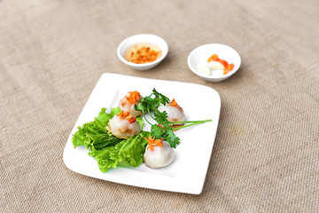 Vietnamese glutinous rice cake or Ram It Hue on white plate with